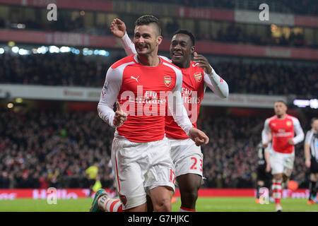 Arsenal's Olivier Giroud (left) celebrates with teammate Danny Welbeck (right) after scoring his sides second goal of the game. Stock Photo