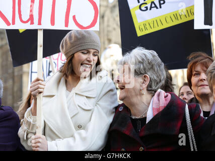 Gemma Arterton (left) with one of the original Dagenham women strikers Vera Sime during a photocall outside the Houses of Parliament, London, to coincide with a Labour bid to force big firms to publish the difference in pay between male and female employees. Stock Photo