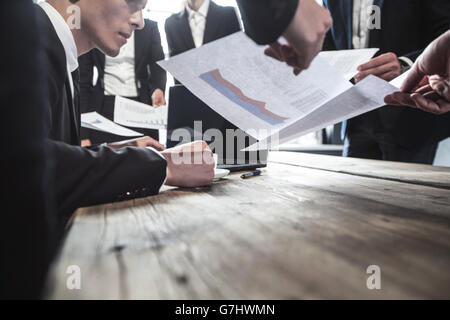 Business man getting extra work deadline concept Stock Photo