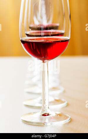 Red wine tasting on the table in a line Stock Photo