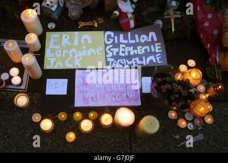 Candles are lit in Royal Exchange Square, adjoining Queen Street, in Glasgow, to remember victims of the Glasgow bin lorry crash at a vigil near the scene. Stock Photo