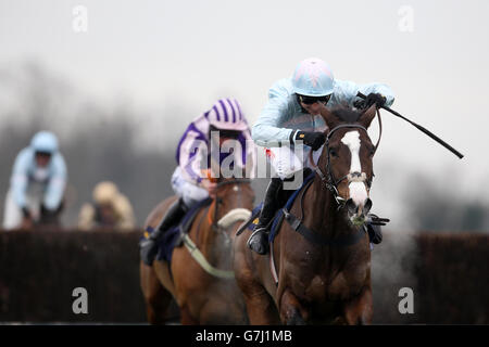 Horse Racing - 2014 William Hill Winter Festival - Day One - Kempton Park. Stellar Notion ridden by Paddy Brennan go on to win the William Hill - Download The App Novices' Limited Handicap Chase Stock Photo
