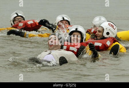 Swimmers take part in the Loony Dook New Year's Day dip in the Firth of Forth at South Queensferry, as part of Edinburgh's Hogmanay celebrations. Stock Photo