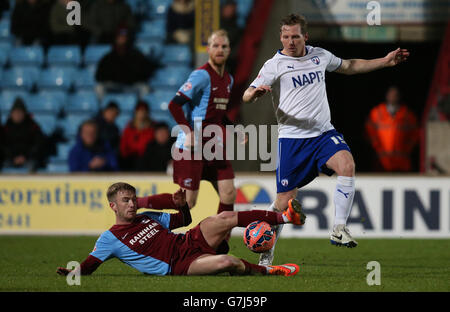 Scunthorpe United's Paddy Madden (left) and Chesterfield's Ritchie Humphreys in action Stock Photo