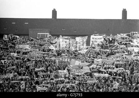 Leeds United fans in the stands at Loftus Road watching their team beat Queens Park Rangers, thus winning the First Division Championship. Stock Photo