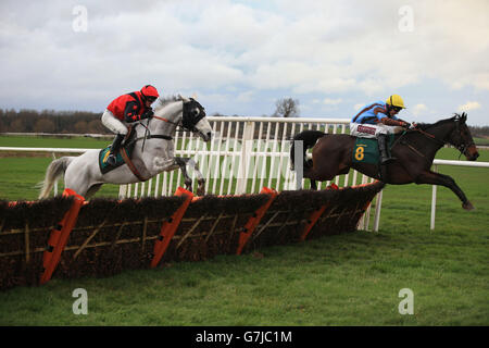 Nordic Nymph (right), ridden by Jake Greenall, jumps the last before going on to win the Equine Lens Handicap Hurdle at Bangor-on-Dee Racecourse, Bangor-on-Dee. Stock Photo