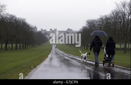 Walkers walk in the rain on the Long Walk in Windsor, Berkshire, as a large swathe of central Britain has been warned to be ready for snow as a cold snap brings freezing temperatures in the lead-up to the New Year.