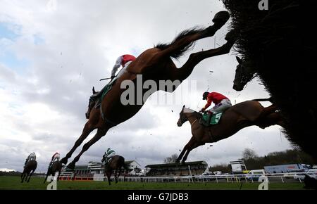 Eventual winner Cogry (right No.5), ridden by Sam Twiston-Davies, jumps the last first time round in the coral.co.uk Money Back If Your Horse Falls Novices' Limited Handicap Chase during Coral Welsh Grand National Day at Chepstow Racecourse, Chepstow. Stock Photo