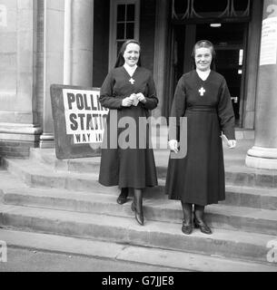 Two nuns leave a polling station at Parliament Hill School after casting their votes in the General Election. They belong to the nearby Convent of the Sainte Union. Stock Photo