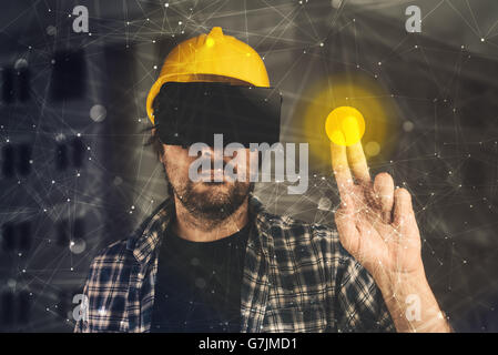 Construction engineer with VR goggles managing building project, futuristic 3d cyberspace technology in architecture Stock Photo