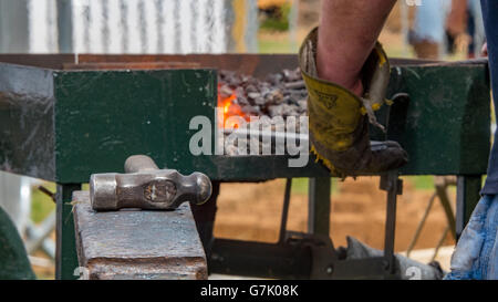 Detailed shot of metal being worked at a blacksmith forge Stock Photo