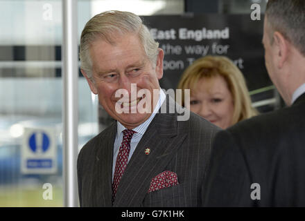 The Prince of Wales talks to workers as he shown the production line of the new electric Leaf cars during a visit to the Nissan UK plant in Sunderland. Stock Photo