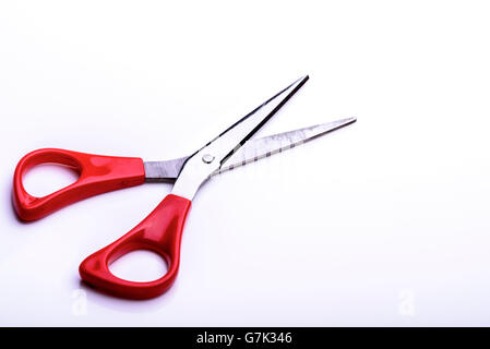 Scissors red plastic stainless steel cutting tool. Stock Photo