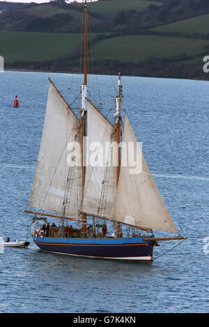 An old 2-masted yacht sailing in the Carrick Roads, Cornwall, England, UK. Stock Photo