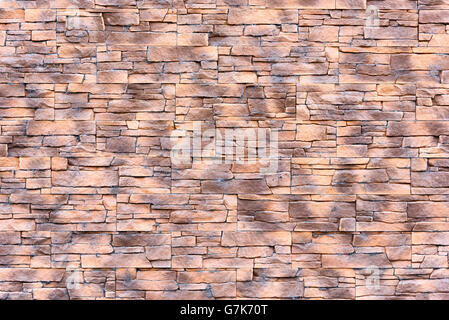 Pattern of orange Modern stone Brick Wall Surfaced Stock Photo