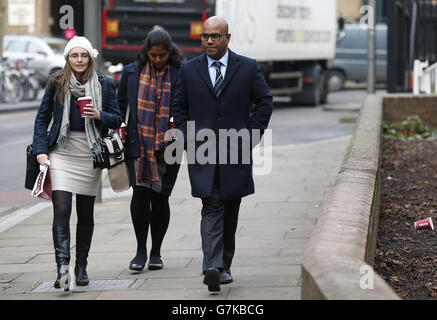 Dr Dhanuson Dharmasena, with unidentified woman, arrives at Southwark Crown Court, where he and another man are facing the first prosecution linked to alleged FGM in England and Wales. Stock Photo