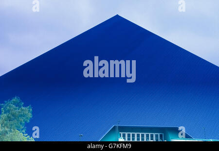 The dark-blue Walter Pyramid is a unique sports arena that is 18 stories tall and has become a landmark since 1994 when it was built on the campus of California State University at Long Beach (CSULB) in Southern California, USA. A prominent feature on that city's skyline, the 5,000-seat facility is home to men's and women's basketball and volleyball at Long Beach State, as well as the school's other athletic and fitness programs. Its vast interior is large enough for nine volleyball and three basketball courts. This pyramid is one of only four true pyramid structures in the United States. Stock Photo