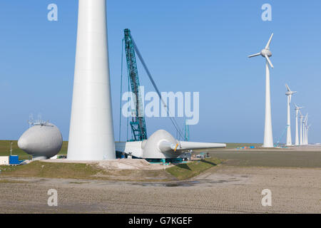 Dutch farmland with construction site new wind turbine farm Stock Photo