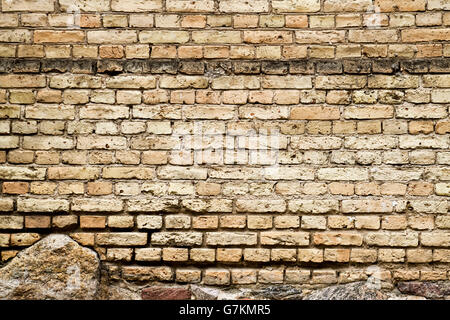 Old brick and stones wall fragment background texture Stock Photo