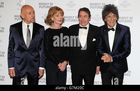 (Left - right) Sir Ben Kingsley, Samantha Bond, Jools Holland and Ronnie Wood wait to meet the Prince of Wales as he attends the annual Princes Trust 'Invest In Futures' reception at the Savoy Hotel in London. Stock Photo