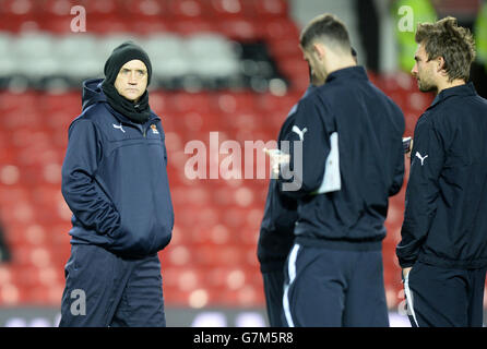 Cambridge United manager Richard Money looks around the stadium with team mates before the FA Cup, Fourth Round replay at Old Trafford, Manchester. PRESS ASSOCIATION Photo. Issue date: Tuesday February 3, 2015. See PA story SOCCER Man Utd. Photo credit should read: Martin Rickett/PA Wire. Stock Photo