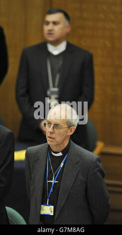 The Archbishop of the Chaldean Diocese of Erbil, Iraq, Bashar Warda, stands behind the the Archbishop of Canterbury the Most Rev Justin Welby, as he waits to give an address during the during the opening day of the General Synod at Church House, London. PRESS ASSOCIATION Photo. Picture date: Tuesday February 10, 2015. See PA story. Photo credit should read: Nick Ansell/PA Wire Stock Photo