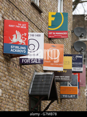 A number of 'To Let', 'Let By' and 'For Sale' signs on a wall of a building in east London. PRESS ASSOCIATION Photo. Picture date: Monday February 16, 2015. Photo credit should read: Yui Mok/PA Wire Stock Photo