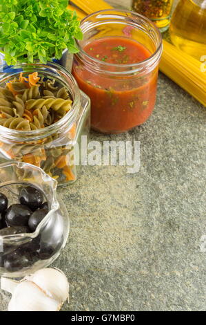 Pasta making ingredients in bowls on a stone table Stock Photo