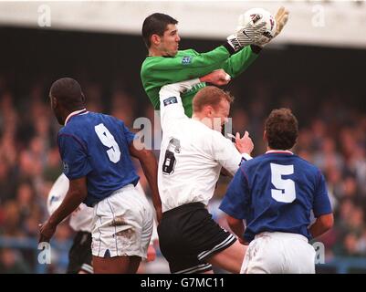 Soccer - FA Cup - Sixth Round - Chesterfield v Wrexham. Billy Mercer, Chesterfield saves from Brian Carey, Wrexham Stock Photo