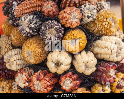 Colourful varieties of dried corn on sale at the San Pedro market in Cusco, Peru Stock Photo