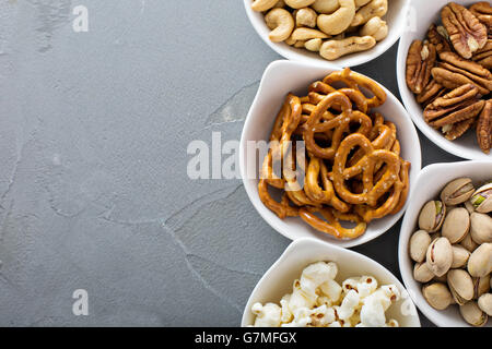 Variety of healthy snacks in white bowls Stock Photo