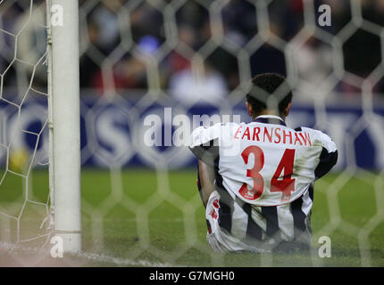 West Bromwich Albion's Robert Earnshaw sits dejected after Liverpool goalkeeper Jerzy Dudek saved his effort Stock Photo