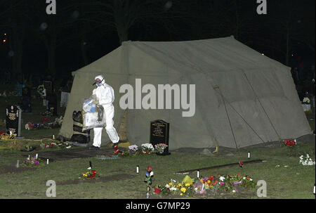 The scene in a cemetery in Shildon, near Bishop Auckland, in the early hours of Wednesday, where police have exhumed the body of a middle aged man. The move follows a review of the practice records at the surgery of 70-year-old Dr Howard Martin at Newton Aycliffe, County Durham. Stock Photo