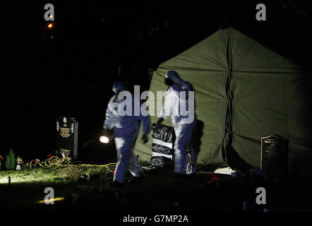 The scene in a cemetery in Shildon, near Bishop Auckland, in the early hours of Wednesday, where police have exhumed the body of a middle aged man. The move follows a review of the practice records at the surgery of 70-year-old Dr Howard Martin at Newton Aycliffe, County Durham. Stock Photo