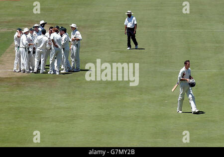 England captain Michael Vaughan (right) leaves the field after being caught by South Africa's Jacques Rudolph. Stock Photo