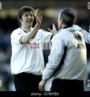 Derby County's Grzegorz Rasiak (left) celebrates with manager George Burley after scoring the opening goal. Stock Photo