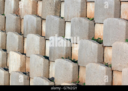 angled view of cement blocks forming pattern and texture of retaining wall Stock Photo