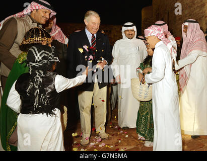 The Prince of Wales is showered with flower petals as he enters the old town of Al Ula in north west Saudi Arabia, on the fifth day of his tour to the Middle East. PRESS ASSOCIATION Photo. Picture date: Wednesday February 11, 2015. See PA story ROYAL Charles. Photo credit should read: John Stillwell/PA Wire Stock Photo