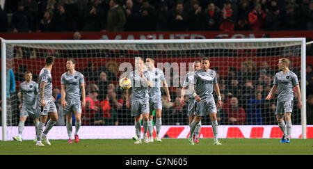 Manchester United and Burnley players walk out onto the pitch for the ...