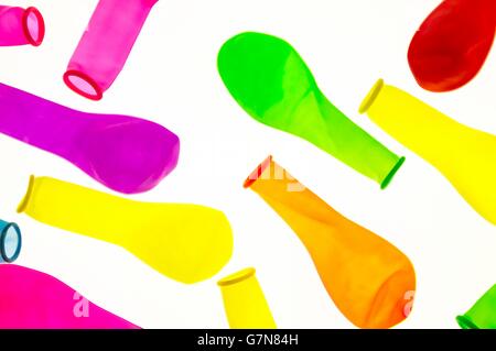 deflated colored balloons , on white background Stock Photo