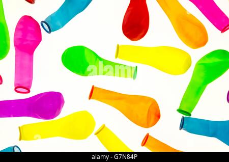 deflated colored balloons , on white background Stock Photo