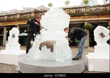 An ice sculpted, life-sized, Iron Throne goes on display in Covent Garden, London, to celebrate the launch of Game of Thrones: The Complete Fourth Season. Stock Photo