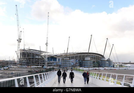 Manchester City fans arrive at The Etihad Stadium before the Barclays Premier League match between Manchester Cityand Newcastle United at the Etihad Stadium, Manchester. Stock Photo