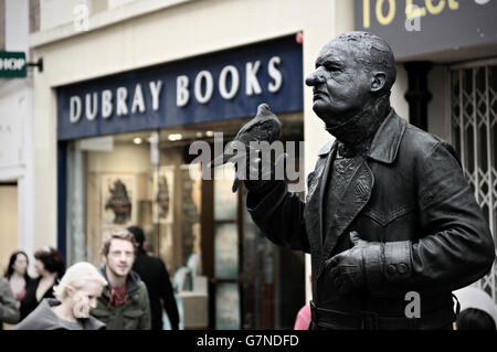 Human statue with a pigeon painted in black in Grafton Street in the city centre of Dublin, Ireland Stock Photo