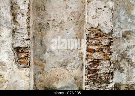 Vintage red brick wall with sprinkled white plaster texture background from oldtown Stock Photo