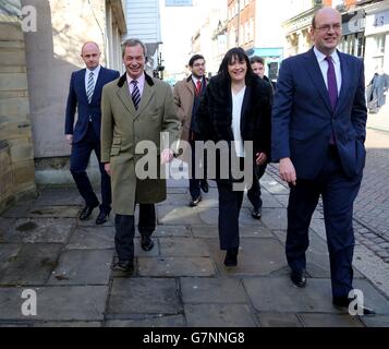 Ukip leader Nigel Farage (left), Ukip health spokesman Louise Bours MEP (centre) with Ukip MP for Rochester and Strood Mark Reckless stop outside the constituency office in Rochester, Kent, as they prepare to unveil the Ukip health policy for the upcoming general election. Stock Photo