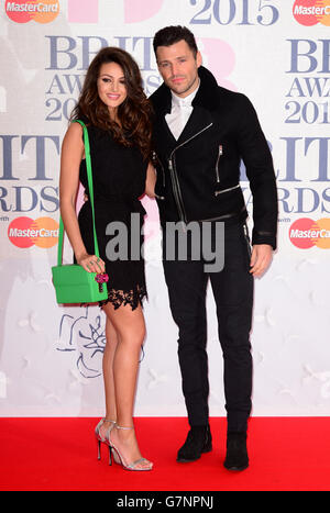 Michelle Keegan and Mark Wright arriving for the 2015 Brit Awards at the O2 Arena, London. PRESS ASSOCIATION Photo. Picture date: Wednesday February 25, 2015. See PA story SHOWBIZ Brits. Photo credit should read: Dominic Lipinski/PA Wire Stock Photo