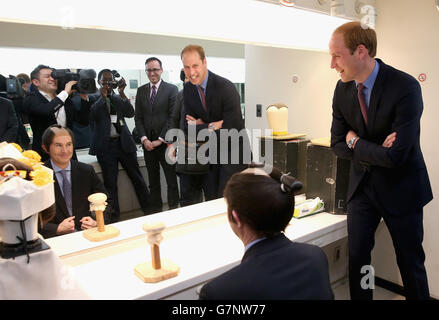 The Duke of Cambridge laughs as British Ambassador to Japan Tim Hitchens wears a Samurai wig during a visit to the set of a historical drama at NHK Public Broadcasting Studios during the third day of his visit to Japan. Stock Photo