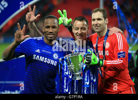(left to right) Chelsea's Didier Drogba, John Terry and Petr Cech celebrate winning the Capital One Cup final with the trophy at Wembley, London. PRESS ASSOCIATION Photo. Picture date: Sunday March 1, 2015. See PA story SOCCER Final. Photo credit should read: Nick Potts/PA Wire. Stock Photo