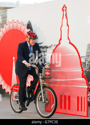 Mayor of London Boris Johnson rides a cycle hire bike at a launch event in central London announcing Santander as the new sponsor of London's cycle hire scheme. Stock Photo